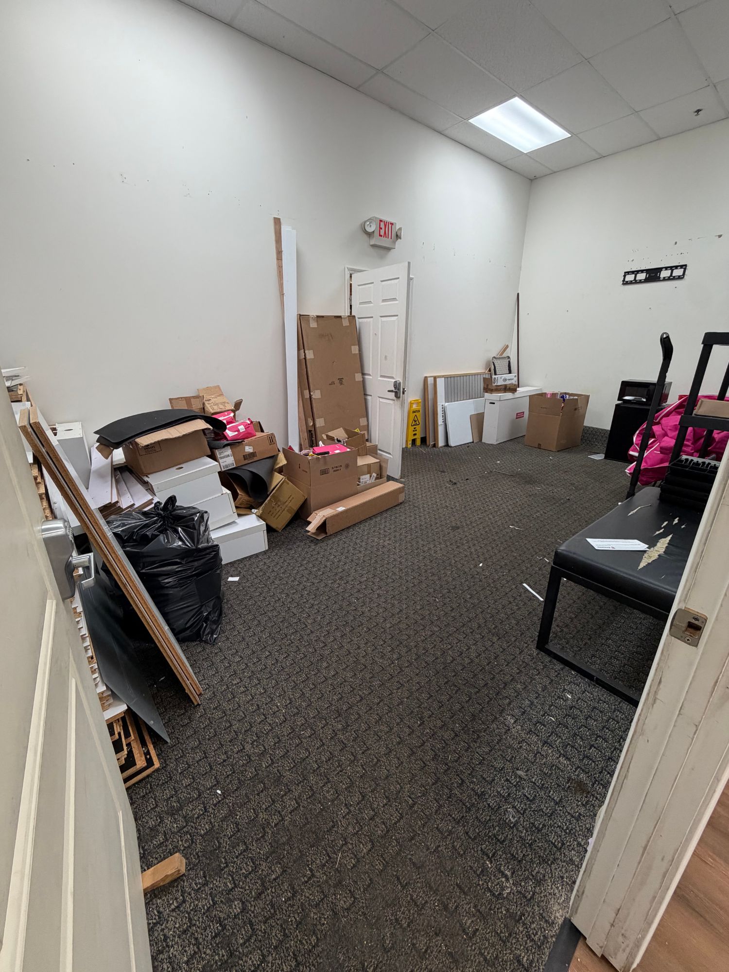 Office cleanout in progress, boxes and bagged debris