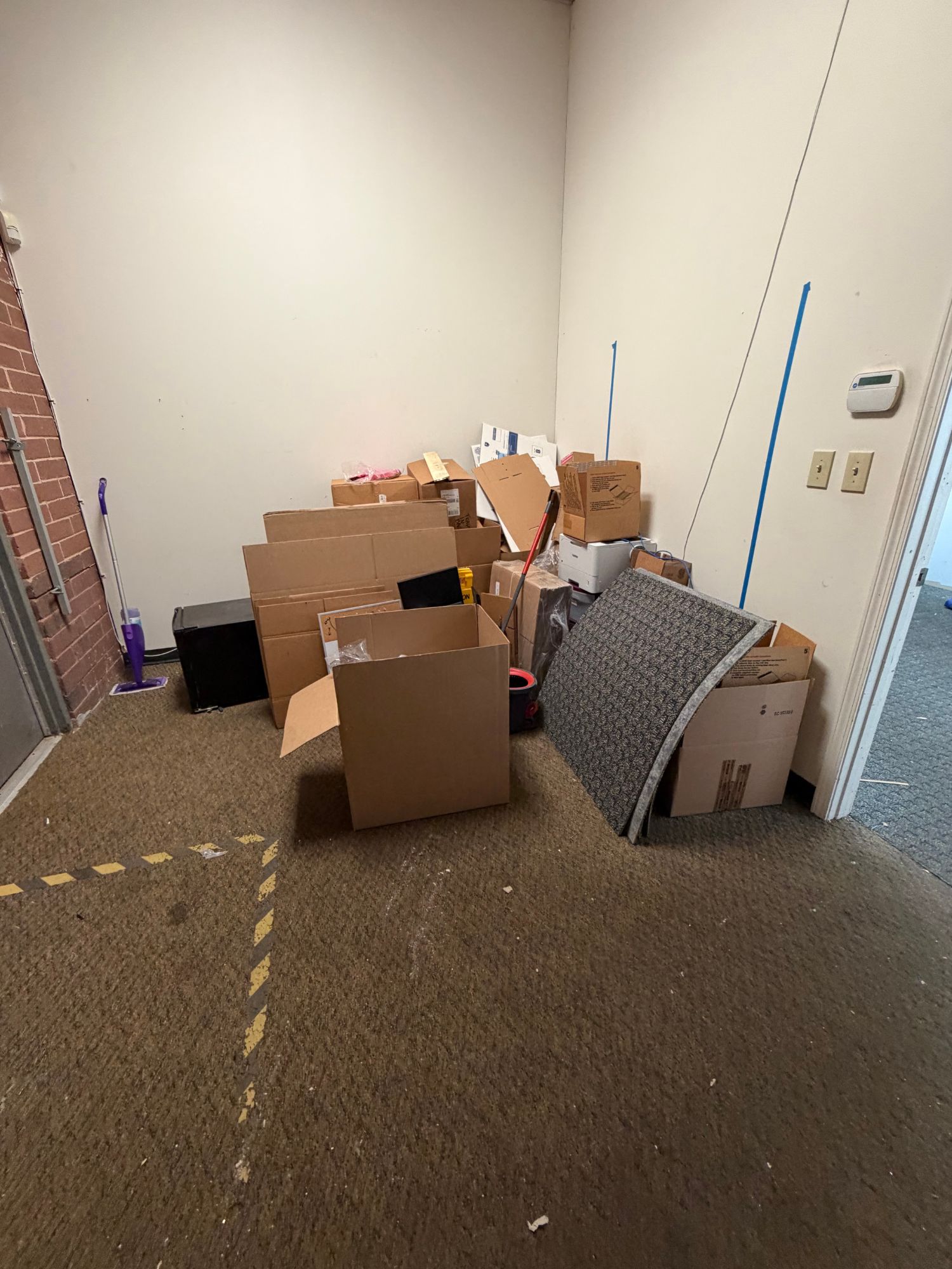 Packing debris and boxes stacked ready for removal