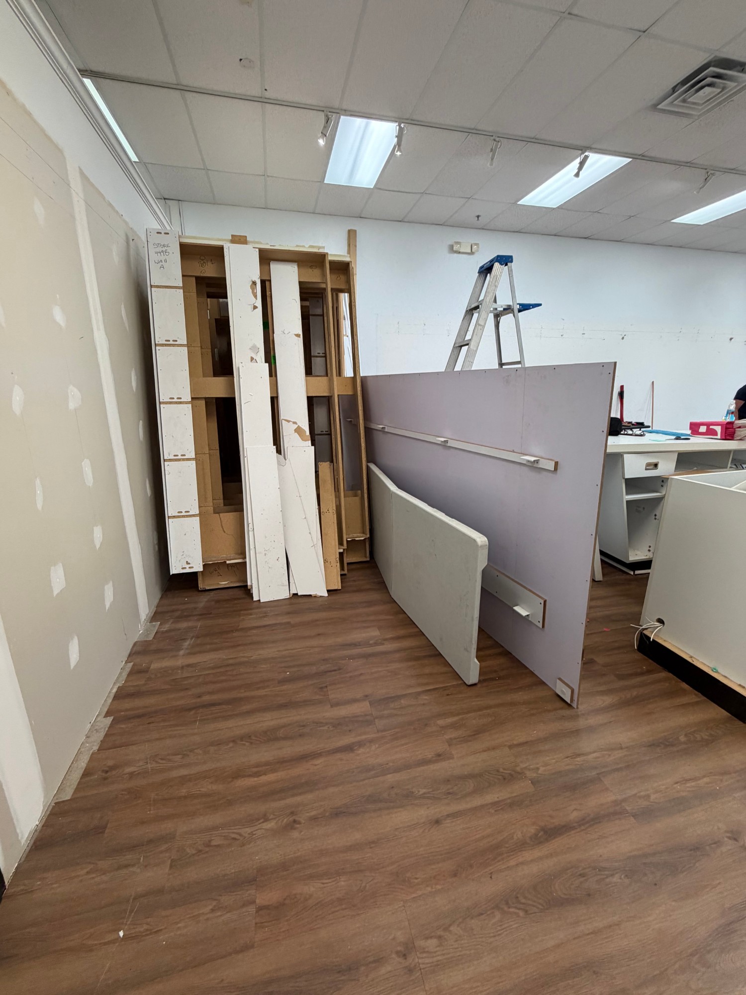 Construction debris and wall panels from a retail strip-out